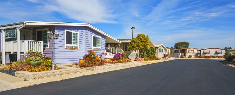 Row of colorful modular homes along neighborhood street