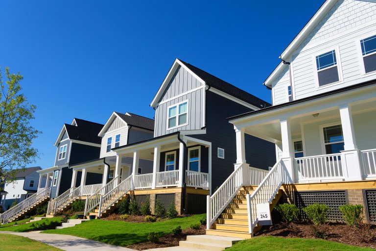 Row of modern modular homes with covered front porches